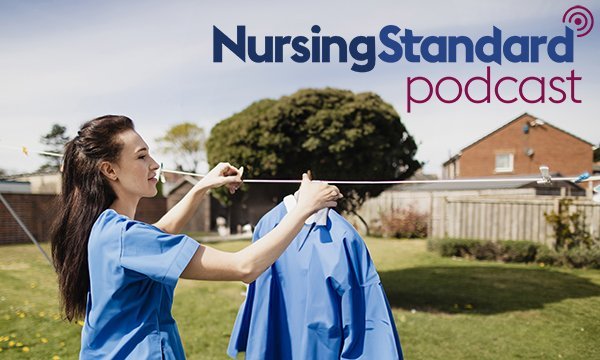 A nurses hanging out her uniform on a washing line