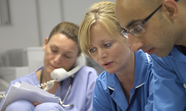 Picture of busy nurses on ward, illustrating story about high nurse vacancy rates