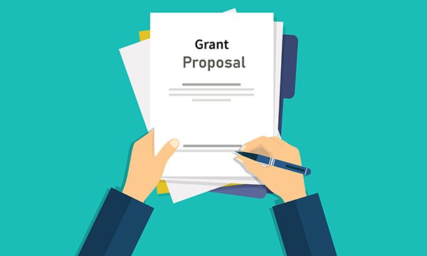 Illustration of hands  holding a pen which is marking a document called 'Grant Proposal'