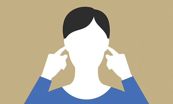 Illustration shows person putting their fingers in their ears to show how the NHS is said to be in denial about racism