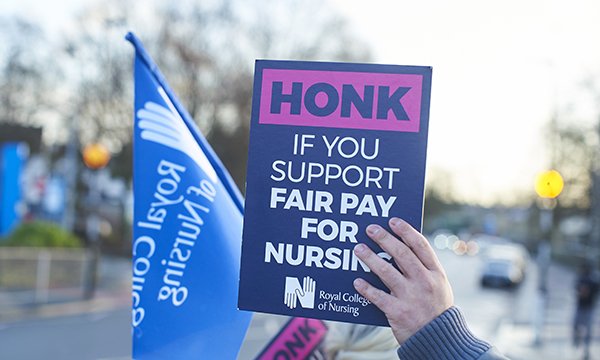 Picture shows a placard being held up in support of fair pay for nursing during the RCN strike in 2022