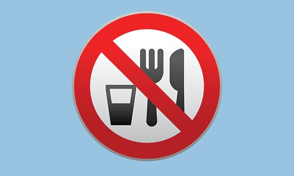 Illustration shows a circle, the outer edges of which are in bold red, with a red stripe going diagonally across a knife, fork and glass filled with liquid, suggesting a nil by mouth instruction
