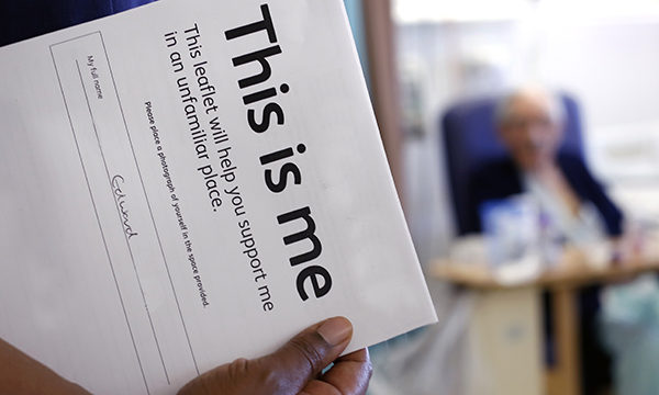 A 'This is me' form and an elderly male patient in the background